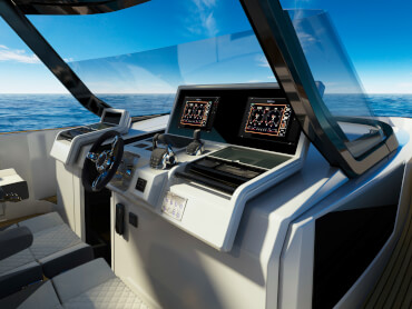FJORD 41 XL | The state-of-the-art glass-bridge helm console is complemented by the largest single-piece windscreen in its class. | Fjord